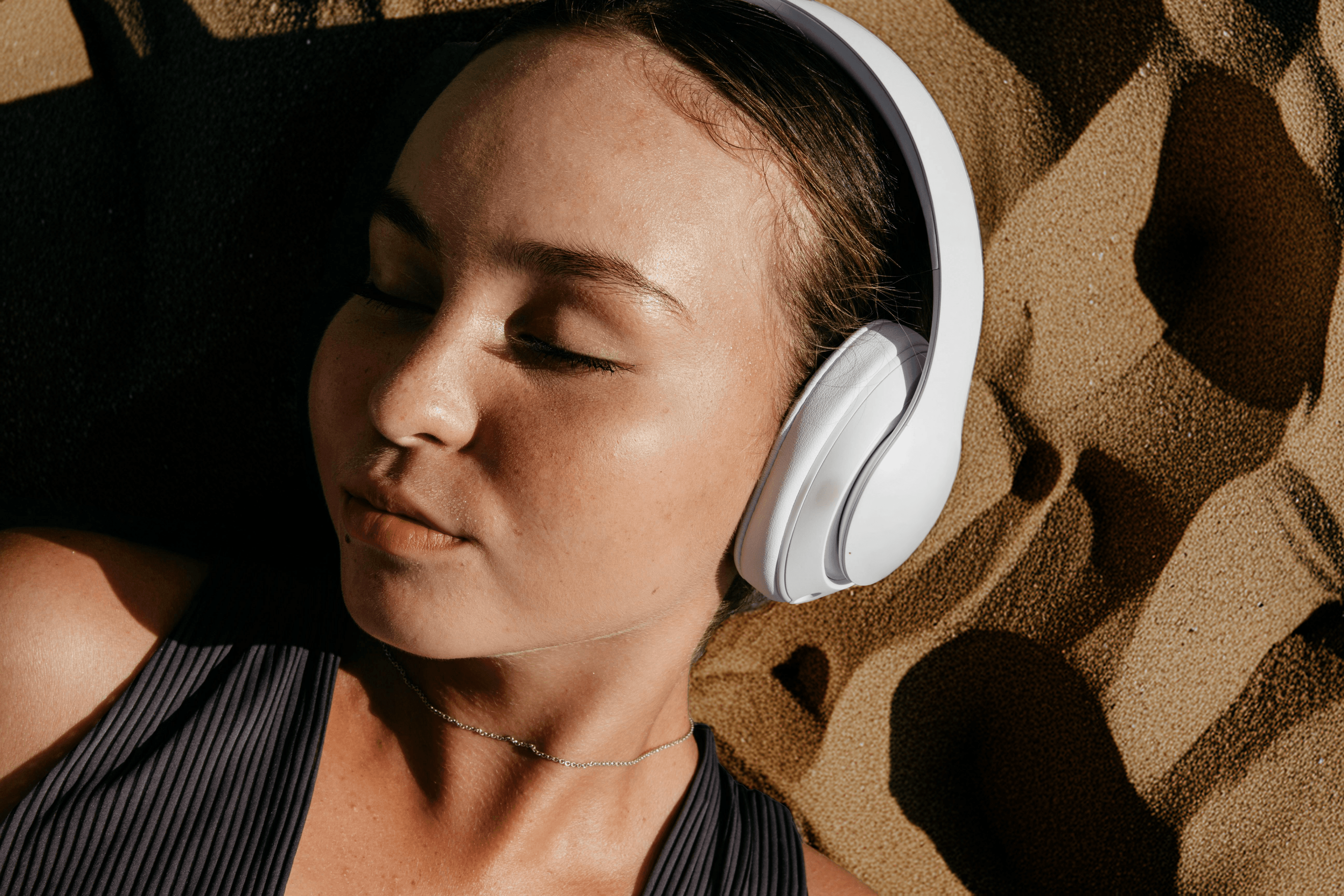 Woman with headphones in desert